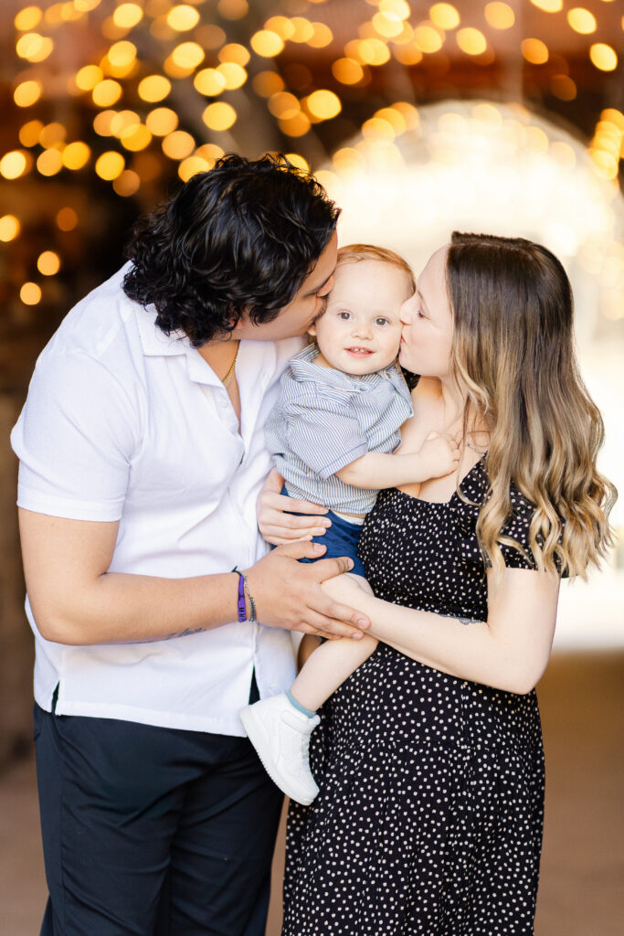 Candid family moment in the Exchange District in Winnipeg with soft evening lights and urban background