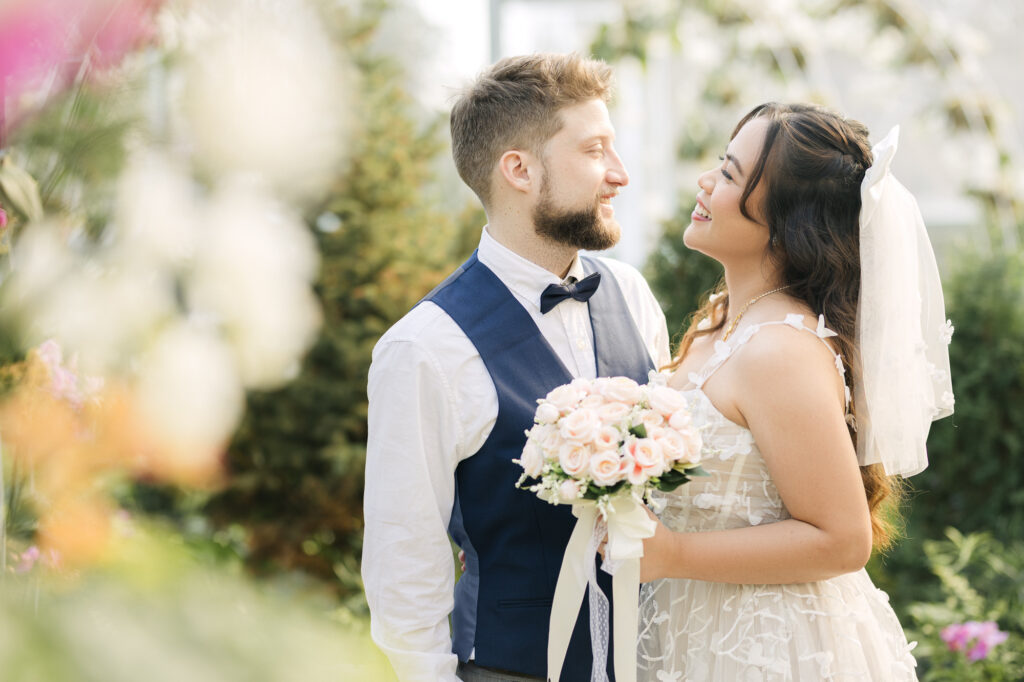 Fine art wedding couple portrait at The Leaf in Winnipeg with soft natural light and romantic garden setting