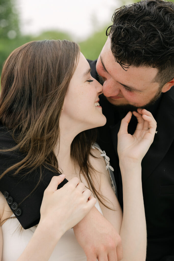 Close-up of bride and groom sharing a soft kiss during wedding photos in Winnipeg Manitoba with natural light
